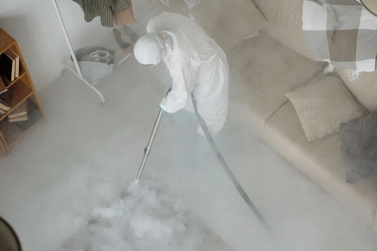 Biohazard cleanup technician in protective equipment, Dresser, WI